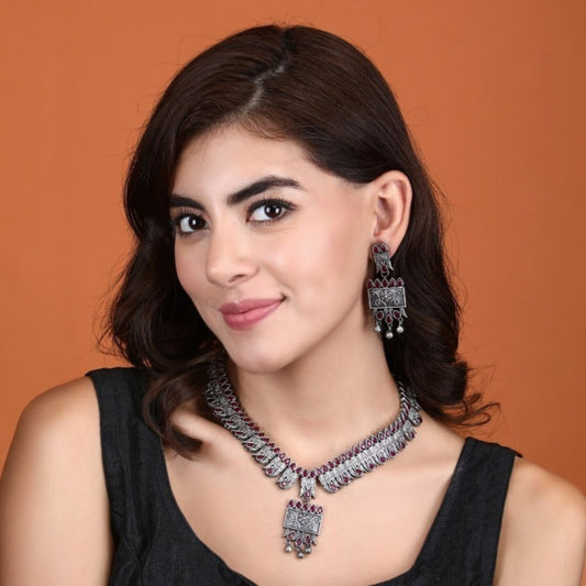Tribal Oxidized Silver-Plated Necklace Set Featuring Red Stone Embellishments and Dangling Drop Earrings